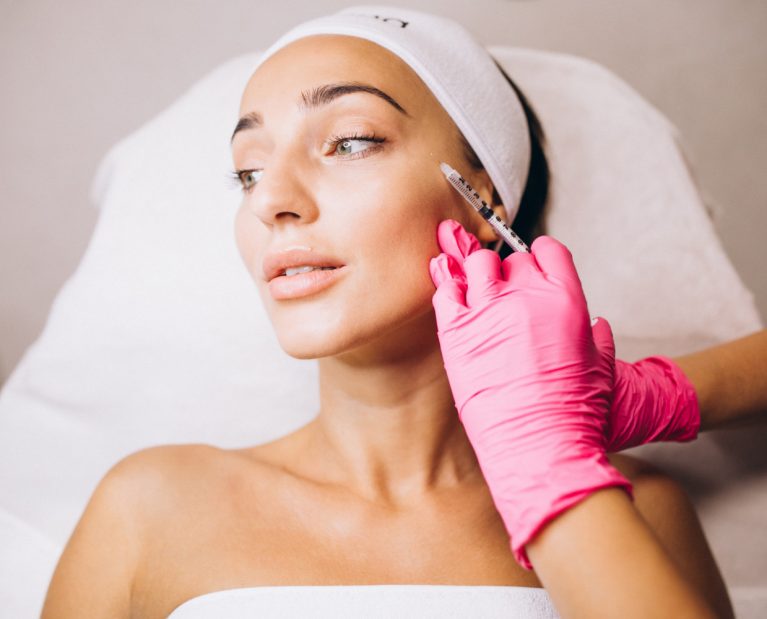 cosmetologist-making-injections-face-woman-beauty-salon